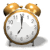 Two side-by-side alarm clock icons with golden bells, white faces showing 7:00, and brown frames on a plain background.