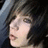 A person with dark hair and bangs appears in a of four , showing subtle facial expression changes across the sequence