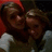 A red background displays a photo of two people on the left, with white text reading "Me" and "Micheala" separated by "&&".