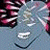 Animated pixelated icon shows a gray creature with pink accents, its mouth open in a grin against a dark background.