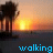 Animated contact sheet of a beach sunset scene with palm trees and text lyrics, showing frame-by-frame changes in heart symbols.