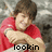 Pixelated image of a person in a red shirt with arms crossed, showing text changes from 'lookin' to 'good' at the bottom.