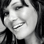 Split image shows two distinct portrait views of a person with dark hair, one in black-and-white and the other in color, both cropped to the upper face and shoulders.
