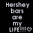 Pixelated text on black background reads 'Hershey bars are my LIFE!!!' with a heart symbol, displayed in two identical side-by-side frames.