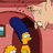 Pixelated cartoon scene with yellow-skinned characters in a pink room, pink text on yellow background, and a blue-capped figure leaning forward.
