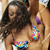 Static 50x50 pixel buddy icon showing two figures in close physical proximity with visible facial features and colorful accessories, rendered in low-resolution pixel art style.