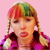 Two side-by-side figures with multicolored hair and braids wear purple jackets against a pink background, with text below reading "Drama" and "Switch-blade Kittens".