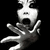 Black-and-white pixelated image of a person with wide eyes and open mouth, hands raised in excitement, next to text reading "My Idol!!!" and a heart symbol.