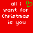 Red background with white pixelated text reading 'all i want for Christmas is you' and a green heart symbol replacing the word 'love'.
