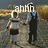 Two pixelated figures stand side-by-side against a blurred background with the word 'amn' in large blocky letters above them.