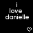 Black background with white text 'i love danielle' repeated across multiple positions, accompanied by pixelated heart and downward arrow symbols in various locations.