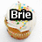 Four cupcakes with white frosting and colorful sprinkles arranged in a , each overlaid with black text boxes containing names or phrases