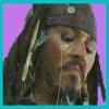 A static icon shows a person with long dark dreadlocks, a dark bandana with a white circular emblem, and a goatee, set against a solid purple background with a cyan border.