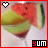 A pixelated image of a watermelon slice in a glass with the text 'yum' at bottom right, featuring a heart symbol that alternates between white and red.