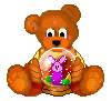Brown teddy bear in yellow shirt holds snow globe with purple rabbit and green base, seated on red fabric against gray background.