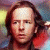 A person with long brown hair appears in three sequential poses: facing forward, raising a hand to the head, and holding an object near the face.