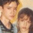 A pixelated image of two people in a close pose with text overlays, showing animation changes in text labels.
