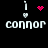 Pixelated icon with 'connor' text, white exclamation mark and heart symbols above it, pink heart or dot cluster animation on black background.
