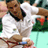 Static 48x48 pixel icon showing a tennis player in mid-swing with blurred background elements, rendered in low-resolution style typical of early internet buddy icons.