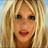 A pixelated image of a person with long blonde hair wearing a white bikini top, standing near water.