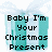 Pixelated text reads "Baby I'm Your Christmas Present" over a teal gift box with light blue cloud-like shapes above it.