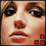 A pixelated close-up of a person's face with red lips and brown eyes, showing two states: one with three red squares at bottom-right and another with four white squares.