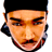 Pixelated static icon of a person's face with black hair, mustache, and beard against white background.
