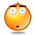 Four orange circular emoji faces with wide eyes, dark eyebrows, and open mouths arranged in a on gray background