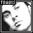 A 7-frame black-and-white animated contact sheet showing a person's face with subtle expression changes across frames, each labeled "TRAVIS" at the top.