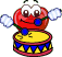 Red cartoon drum character with large white eyes and blue cheeks, holding white drumsticks above a yellow drum head.