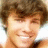 A pixelated image of a person with brown hair and light skin, next to red text reading 'i love ryan sheckler!' on a white background.