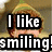 A pixelated image of a person with curly hair wearing a green hat and white shirt, overlaid with bold text reading "I like smiling is my favorite!!".