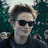 Six- of a person with short light brown hair in various poses, some wearing sunglasses and dark clothing against green or white backgrounds