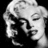 Black-and-white pixelated image of a woman with blonde hair, featuring text 'Screw heros' and 'legends never die' on black background.