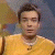 A pixelated image of a person in a yellow shirt with short brown hair against a blurred background, next to green text reading 'Original Icons .com' on dark green.