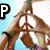A person in a brown outfit makes a peace sign with both hands against a light blue background, while text characters change sequentially.