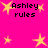 Bright pink background with yellow star shapes and black text reading "Ashley rules" in pixelated font.