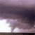 A pixelated image with a gradient background transitioning from light purple at the bottom to dark purple at the top, featuring a faint, indistinct shape resembling a tree or abstract form in the center.