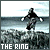 Pixelated image of a figure in mid-air above water with 'THE RING' text at bottom.
