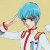 Pixelated figure with blue hair, red tie, and white shirt holding a brown object against light yellow background.