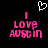 Pixelated pink text 'I LOVE AUSTIN' with a white heart outline above, on black background.
