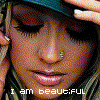 repeated close-up images showing a person with dark eyelashes, light skin, and a nose ring, wearing a teal cap and striped fabric, with text below each image
