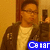 A person in a brown jacket and white shirt holds a dark phone, with blue text overlay on the lower portion of the image.