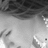 Black-and-white animated icon shows a person with dark hair and closed eyes, wearing a light-colored top with visible collar details.