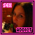 Pixelated image of a person with dark hair and glasses, framed by pink border with 'SEX' and 'ADDICT' text blocks.
