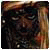 Pixelated static image of a person's face with dark hair and a blurred background featuring warm brown and orange tones.