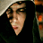 Animated sequence showing a hooded figure with glowing orange eyes and a young man's face, transitioning through motion blur effects.