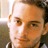Static 48x48 pixel icon showing a close-up of a person's face with brown hair and light skin tone, rendered in low-resolution pixel art style.