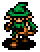 Pixel art character with green hat and clothing, brown boots, orange facial features, black outline, standing against gray background.