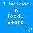 Blue background with white pixelated text reading "I believe in Teddy Bears" and two heart symbols below the text.